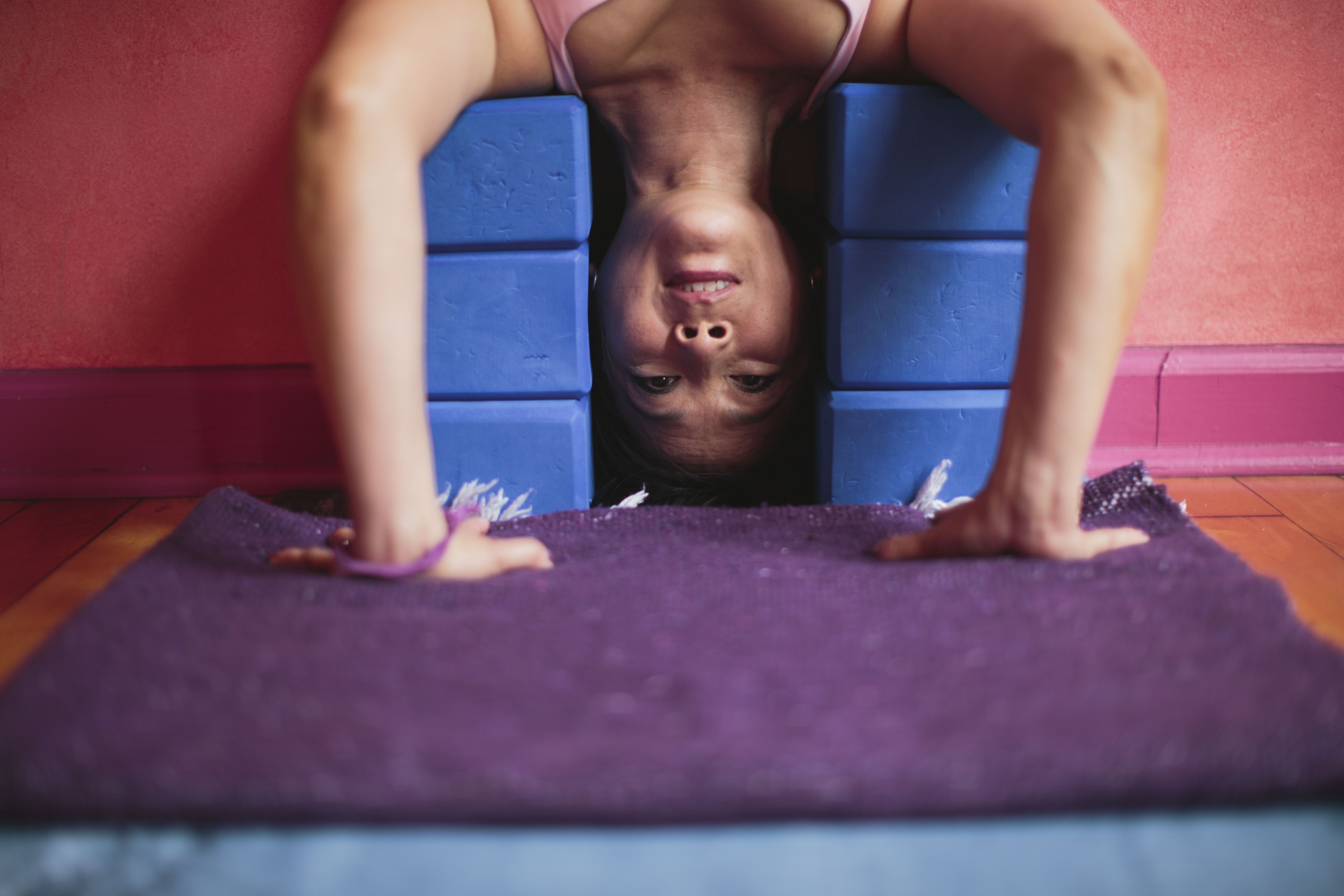 An Innovative Supported Headstand That Will Help You Overcome Your